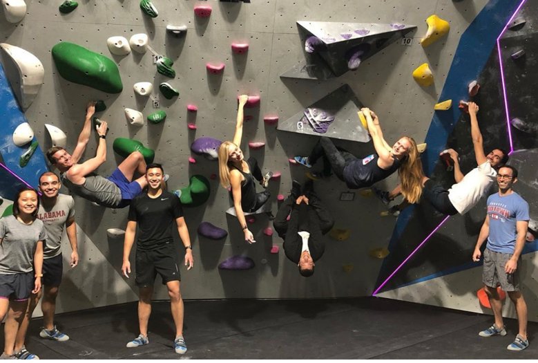 clubs members rock climbing indoors